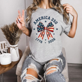 America 250 Stars and Stripes Bow T-Shirt – Coquette Patriotic Graphic Tee